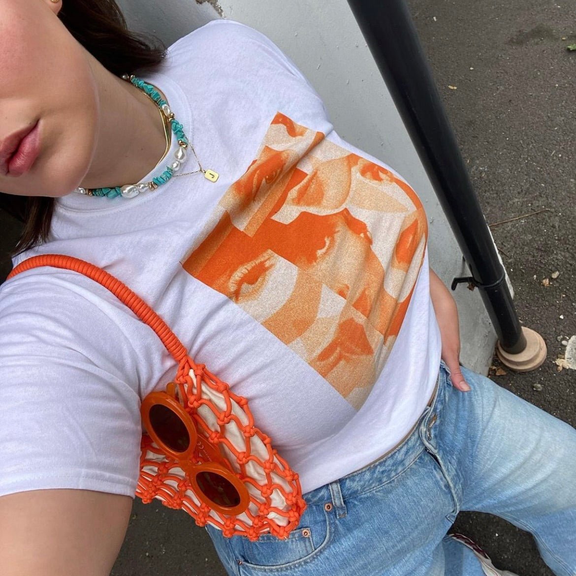 'Many Faces' baby tee - In Print We Trust