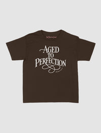 aged to perfection baby tee - In Print We Trust