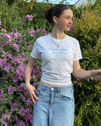 everything happens baby tee - In Print We Trust