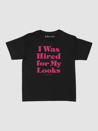 hired for my looks baby tee