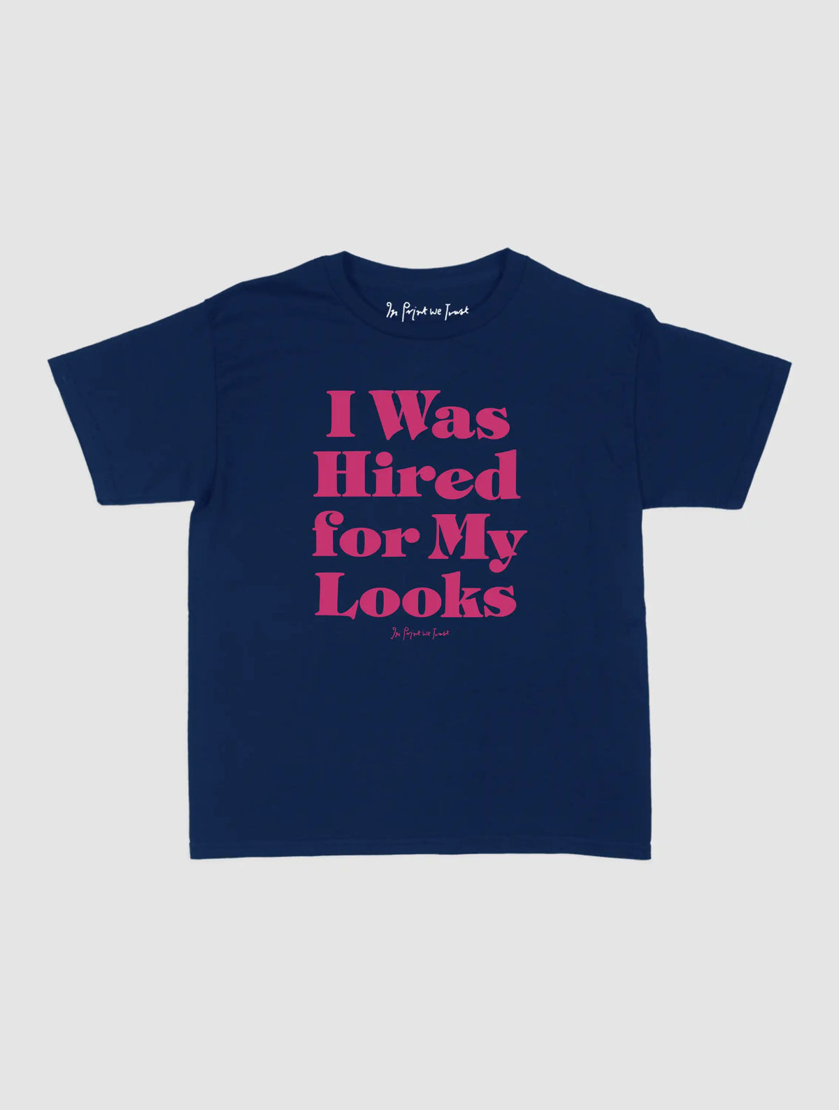 hired for my looks baby tee