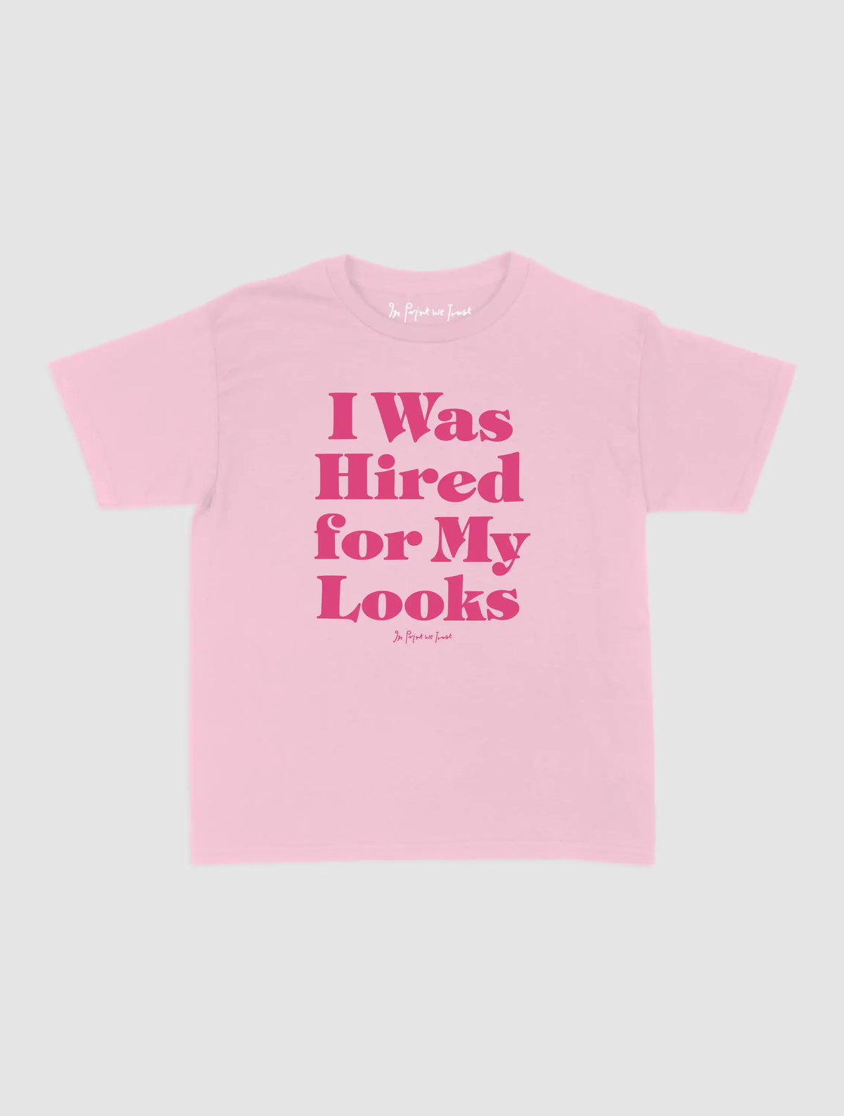 hired for my looks baby tee