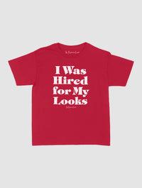 hired for my looks baby tee