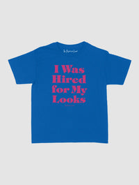 hired for my looks baby tee