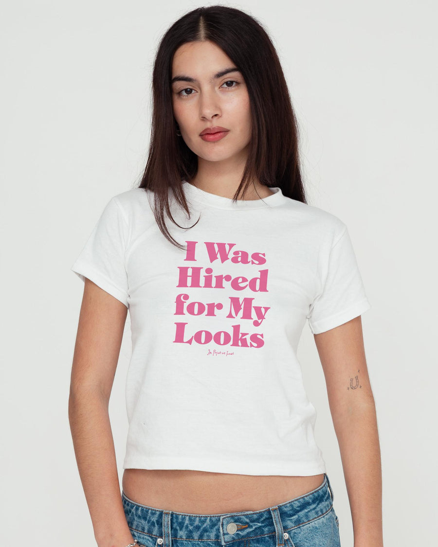 hired for my looks baby tee - In Print We Trust