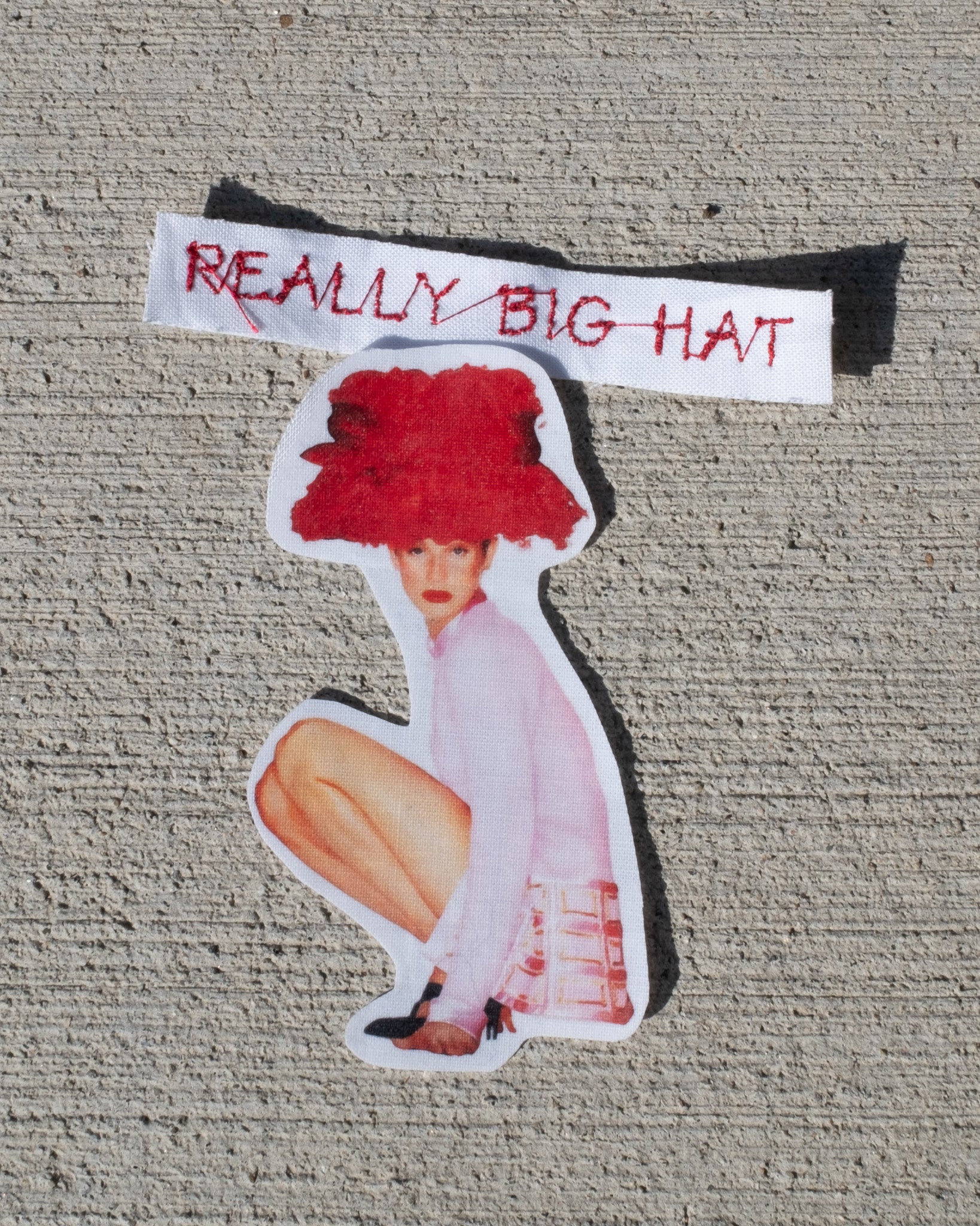 really big hat baby tee - In Print We Trust