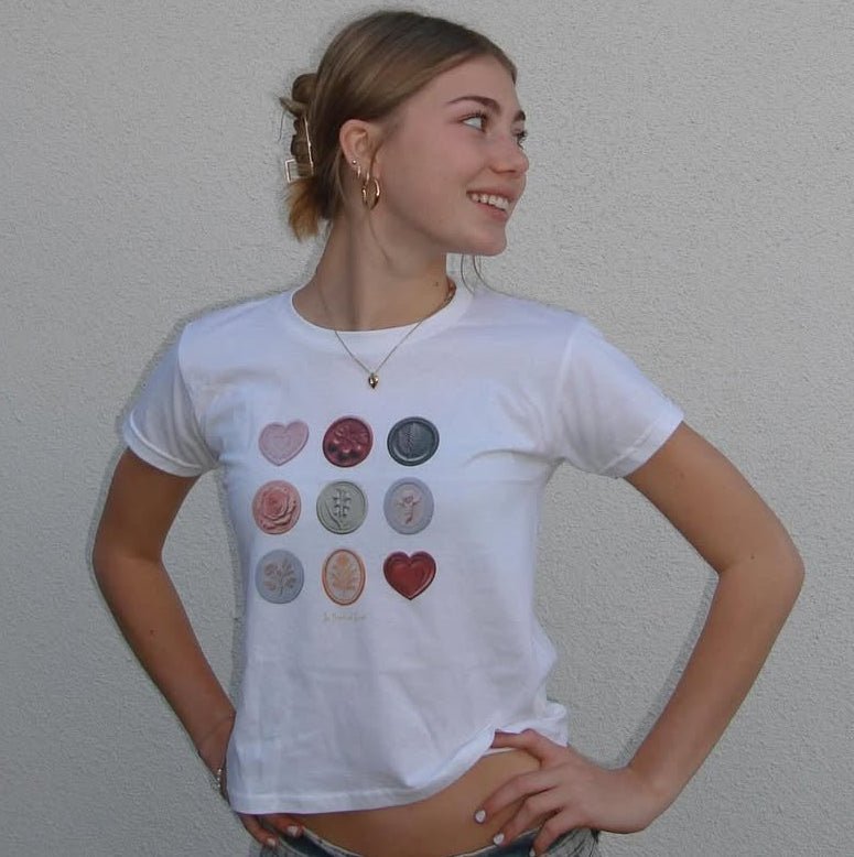 sealed with a kiss baby tee - In Print We Trust