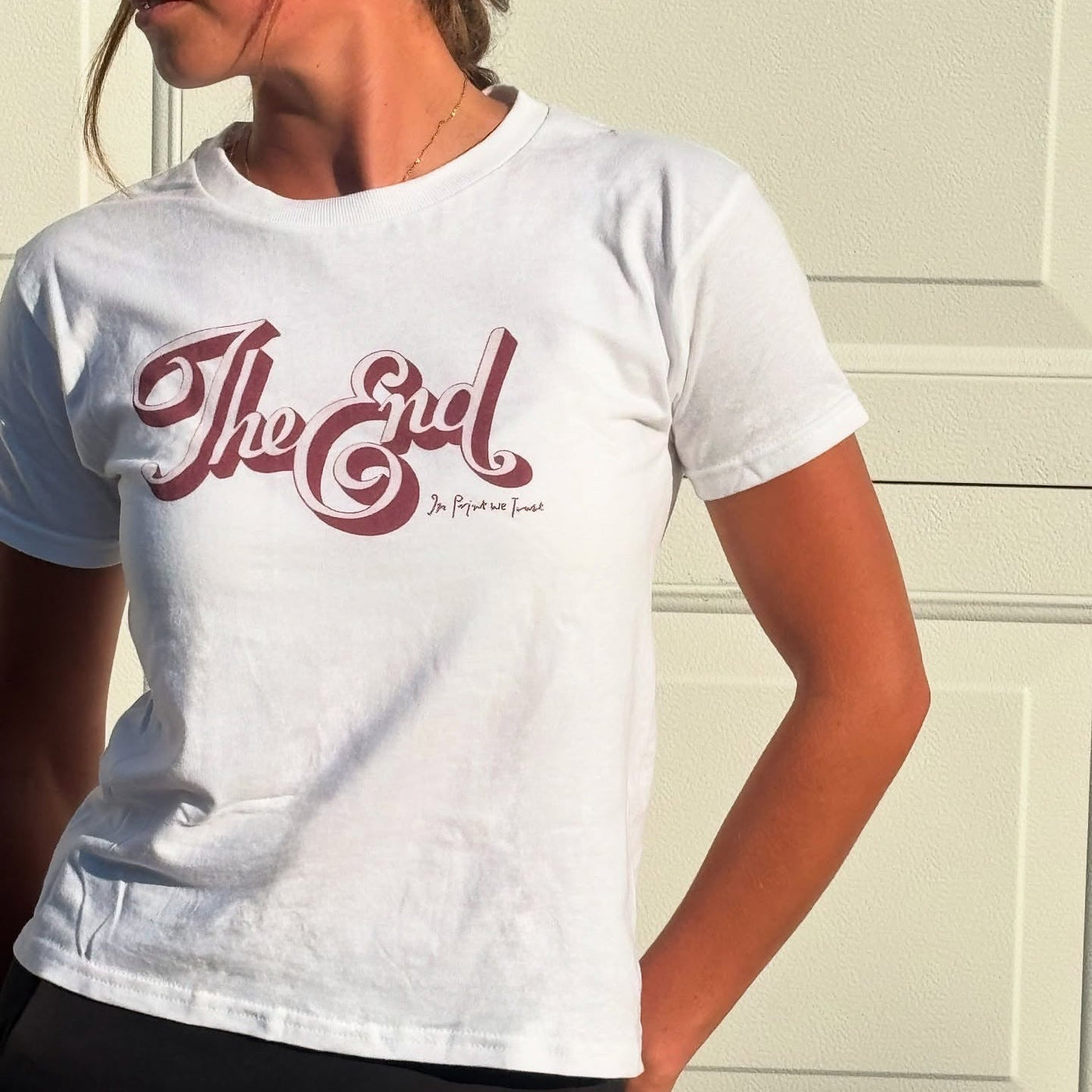 the end baby tee - In Print We Trust